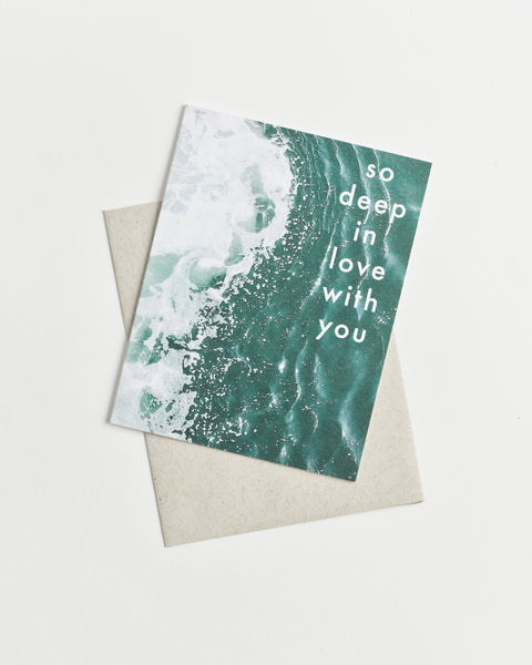 Photo greeting card with deep teal ocean waters and “So Deep in Love With You” in white letters.
