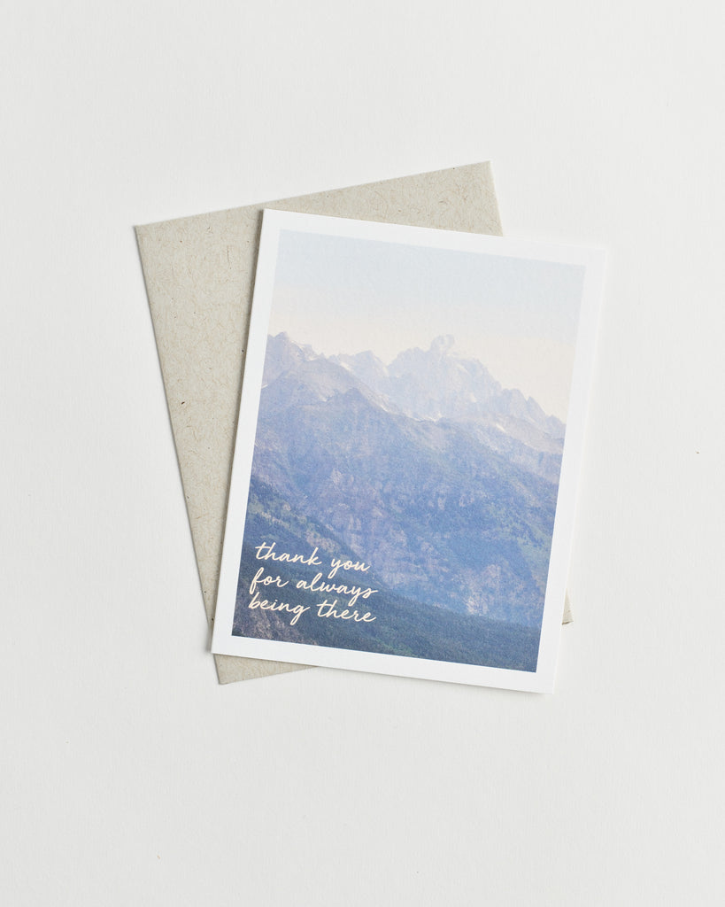 Photo greeting card of misty mountains and words “thank you for always being there” in cursive.