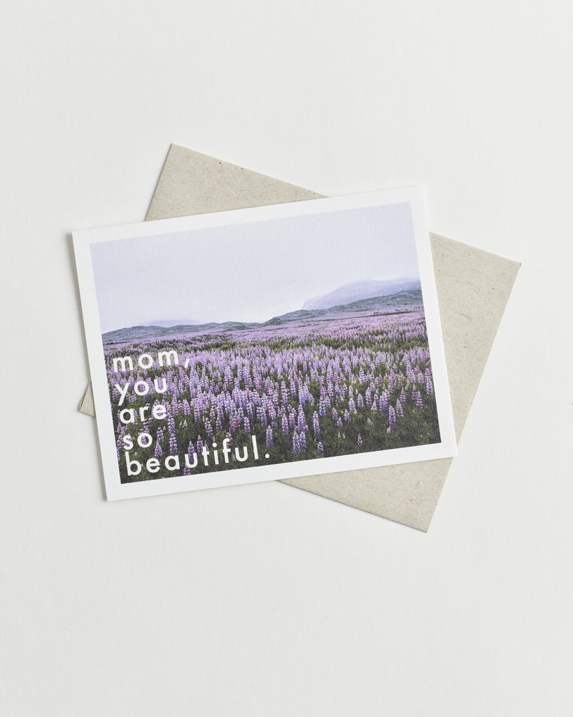 Photo greeting card of a field of purple flowers and words “mom, you are so beautiful”.