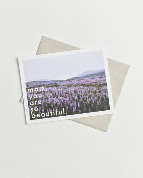 Photo greeting card of a field of purple flowers and words “mom, you are so beautiful”.