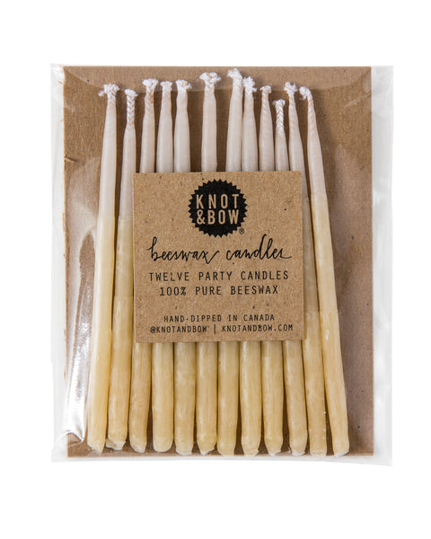 Package of 12 hand-dipped yellow beeswax birthday candles with ombré effect