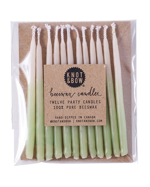 Package of 12 hand-dipped mint color beeswax birthday candles with ombré effect