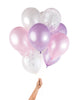 Bunch of party balloons in a mix of pearl effect pink and purple unicorn colors and clear balloons filled with iridescent confetti