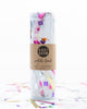Confetti bomb tube of 1 ounce of party confetti in a mix of white and metallic rainbow in different shapes.