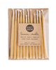 Package of 12 tall hand-dipped beeswax birthday candles in a natural pale yellow color.
