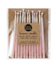 Package of 12 hand-dipped pink beeswax birthday candles with ombré effect