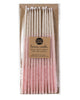 Package of 12 tall hand-dipped pink beeswax birthday candles with ombré effect