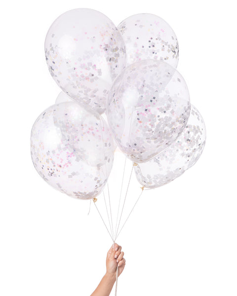 Bunch of clear balloons filled with white and iridescent confetti