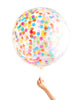 Clear jumbo balloon filled with assorted rainbow circle confetti.