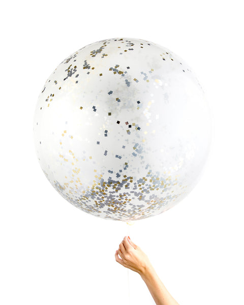 Clear jumbo balloon filled with a mix of white and gold metallic confetti.