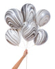 Bunch of black and white party balloons with a marble effect.