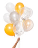 Bunch of party balloons in a mix of silver and gold colors and clear balloons filled with silver and gold metallic confetti